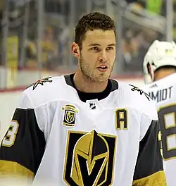 Hockey player wearing a white Vegas Golden Knights hockey jersey
