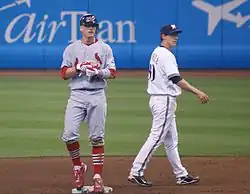 Brendan Ryan standing on second base as infielder Craig Counsell walks to right side of the image