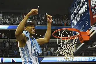 Image 3Brice Johnson cuts down the nets after winning the 2016 ACC tournament with North Carolina