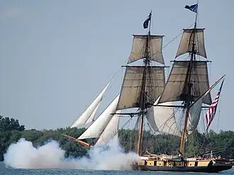 The U.S. Brig Niagara firing its cannons, off Put-in-Bay harbor