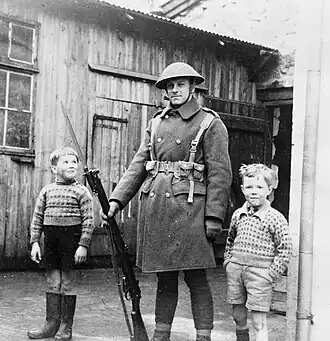 Image 6British Army soldier with local children in Tórshavn (from History of the Faroe Islands)