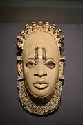 Pendant mask; by artists of the Edo people (Nigeria); 16th century (?); ivory and iron; height: 24.5&nbsp;cm; British Museum, London[108]