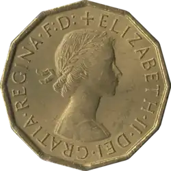 12-sided coin bearing a woman's head