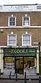 F Cooke's pie and mash shop stands at the southern entrance to Broadway Market. (January 2006). It has since been converted into a Cubitts glasses shop.