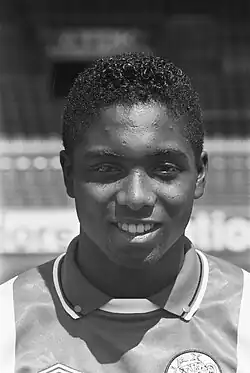Black and white portrait photograph of a 19-year-old Bryan Roy in his Ajax jersey