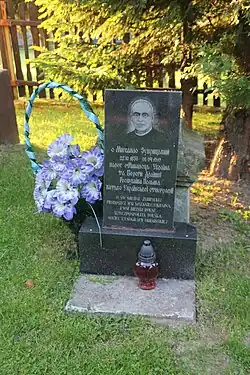 Zubrytskyi's grave, with blue-and-white flowers