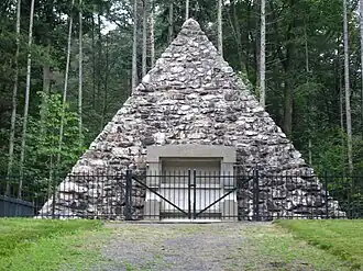 The stone pyramid marking the site of President Buchanan's birth in the park