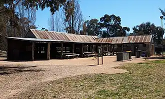 One of the remaining buildings of Kambah Woolshed, now converted into a barbecue area