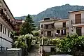 Buildings of Piana degli Albanesi with Mount Pizzuta in the background