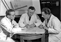 Image 6Engineers conferring on prototype design, 1954 (from Engineer)