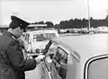 East German border guards checking vehicles at the checkpoint in Drewitz in March 1972 after the easing of travel restrictions into East Germany