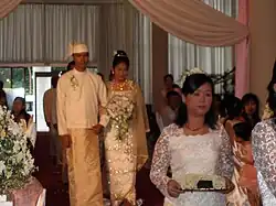 Image 40A wedding procession, with the groom and bride dressed in traditional Burmese wedding clothes, reminiscent of royal attire (from Culture of Myanmar)