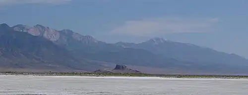 Flat expanse with a mountain range in the distance