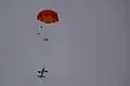 Surveyor drone deploys parachute for recovery