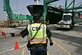 U.S. CBP officer directing a truck