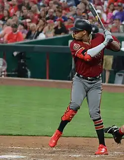 Ketel Marte in a red Arizona Diamondbacks uniform, batting left-handed