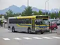 A regular-length high-floor commuter bus