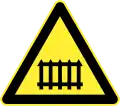 Railway crossing ahead (with safety barriers)