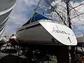 Reverse transom with rudder mounted under the hull