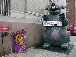 Image 17AFL–CIO unions protest outside Verizon headquarters in Philadelphia using a giant inflatable rat.