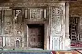 Marble decoration in the prayer hall, including a panel of square Kufic above the door in the middle, pictured in 2015