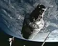 Canadarm2 moving the Harmony module