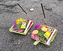 With incense at a beach in Canggu