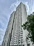 A skyscraper with a white painted exterior.