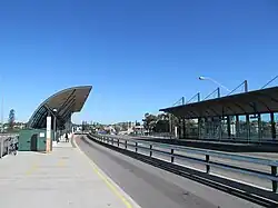 A road with large bus shelters on either side