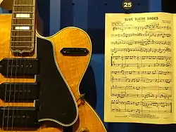 Carl Perkins' guitar and sheet music of "Blue Suede Shoes"