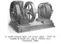 A photo of machinery. On the left is what appears to be a small gasoline engine with two flywheels. On the right, connected to the engine by a shaft, is what appears to be an electrical generator. These are mounted on a common base. Text reads "A small isolated light and power plant. Made by Carlisle & Finch Co. 229 E. Clifton Ave., Cincinnati, Ohio"