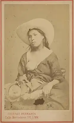 Photograph of a woman breastfeeding her child, by the Courret Brothers (Peru)