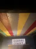 A ceiling painted in red, blue, and yellow lines