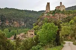 View of the village, castle and the church of Santa Maria