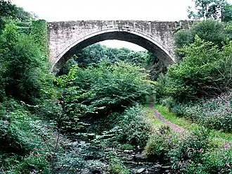 Stone arch railway bridge