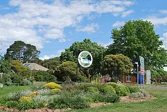 Sign and a small garden at Cavendish