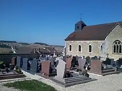 The commune's cemetery overlooking the village and its surrounding fields