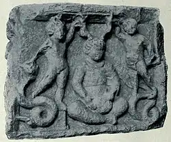 Cernunnos on an altar from Vendœuvres, Indre. Cernunnos, unusually youthful looking, is depicted between two genii atop serpents.: no 15 