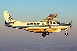 A Cessna airplane photographed mid-flight