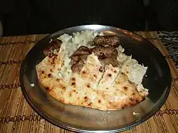 Image 50Bosnian ćevapi with onions in a somun. (from Culture of Bosnia and Herzegovina)