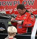 Signing autographs for a kid in 2011