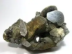 Disc-shaped, brown siderite crystals perched upon chalcopyrites