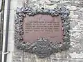 Plaque on the side wall