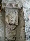A peasant, wearing a bliaud, thrusting a spear into the mouth of an enormous dragon