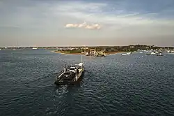 The On Time III, a three-car and passenger ferry boat crossing the channel in Edgartown Harbor.