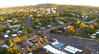 Aerial view of Richmond Hill, looking from the intersection of Bridge Street with Hackett Terrace (lower right) and then SSW along the curve of Bridge Street with Mosman Street in the centre of Charters Towers and Towers Hill in the distance