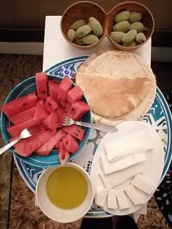 Watermelon is traditionally served with Akkawi or Nabulsi as table cheeses[12]