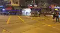 Protesters shine laser pointers toward police.