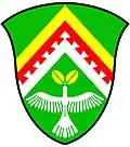 a chevron enhanced - Vert; a chevron enhanced, per chevron or and argent, over the partition line another, the lower edge dovetailed, gules, in base a dove ascending argent, holding in its beak two leaves or - Kwnanonzame Town Committee, RSA