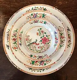 A set of medallion, rice dish, and dinner plate of the Double Peacock Dinner Service, famille rose